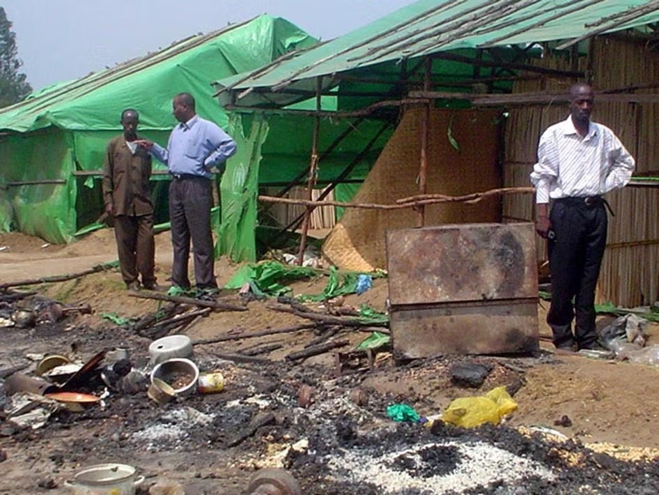 Burned shelters and debris at the Gatumba refugee camp after the massacre